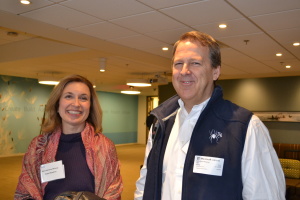 Symposium attendees take a moment from networking to pose for a photo.