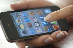 Female hand holding an Apple iPhone 4